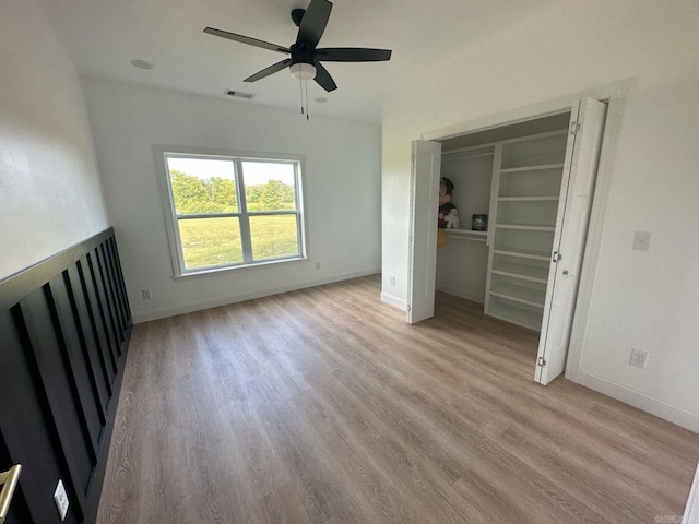 1656 Airport Dr, Mountain View, AR 72560 - unfurnished living room with light wood-type flooring, a ceiling fan, and baseboards