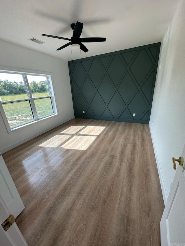 1656 Airport Dr, Mountain View, AR 72560 - empty room with baseboards, light wood-style floors, and a ceiling fan