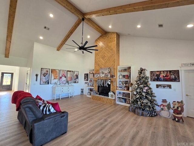 1656 Airport Dr, Mountain View, AR 72560 - living room with high vaulted ceiling, beam ceiling, a large fireplace, wood finished floors, and a ceiling fan