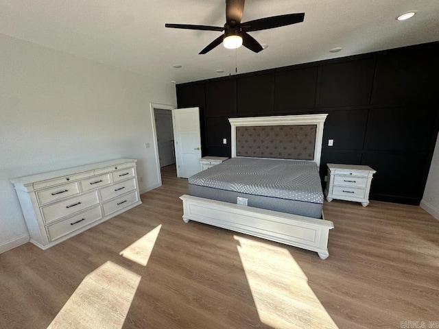 1656 Airport Dr, Mountain View, AR 72560 - unfurnished bedroom featuring light wood-type flooring, baseboards, a ceiling fan, and recessed lighting
