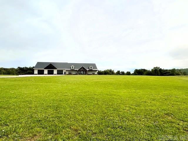 1656 Airport Dr, Mountain View, AR 72560 - view of front of property with an attached garage, a front lawn, and driveway