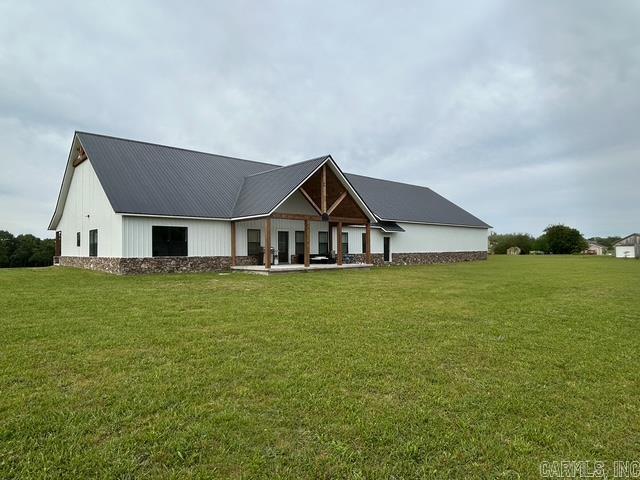 1656 Airport Dr, Mountain View, AR 72560 - view of front of home with a front lawn and metal roof