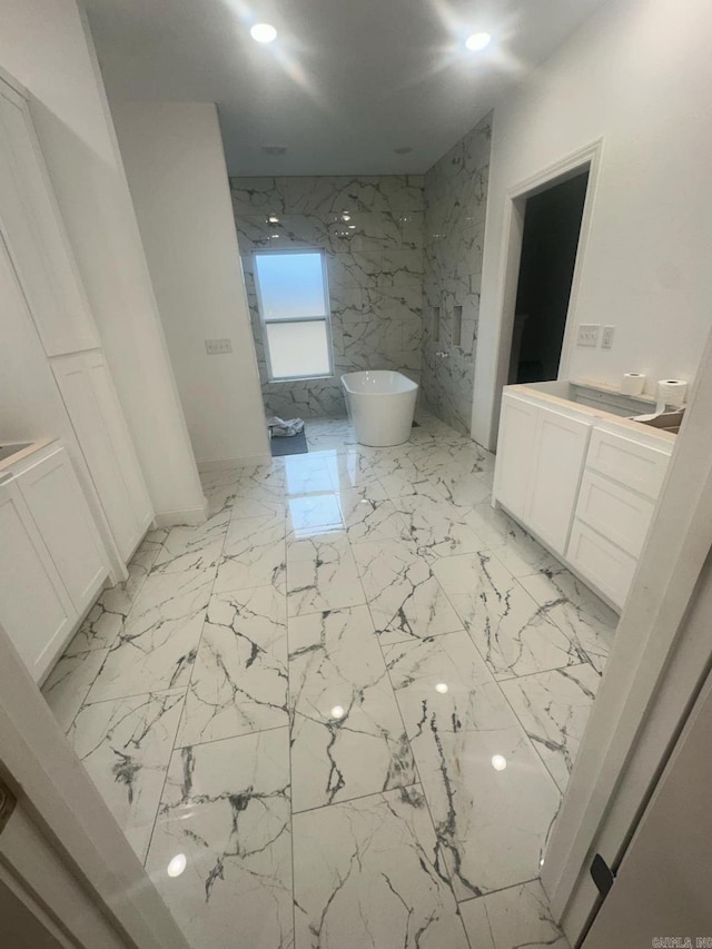 1656 Airport Dr, Mountain View, AR 72560 - bathroom with a freestanding tub, marble finish floors, recessed lighting, vanity, and a marble finish shower