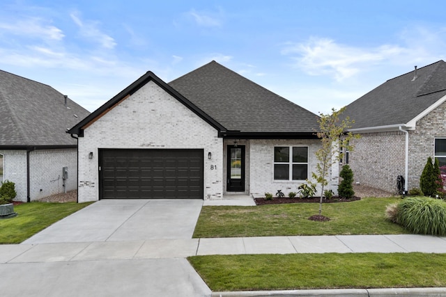 81 Fletcher Ridge Dr, Little Rock, AR 72223 - view of front facade with an attached garage, a front yard, concrete driveway, and brick siding