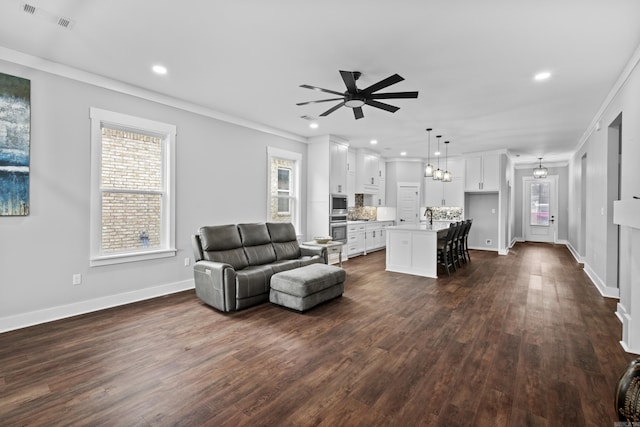 81 Fletcher Ridge Dr, Little Rock, AR 72223 - living area with a ceiling fan, dark wood-type flooring, ornamental molding, recessed lighting, and baseboards