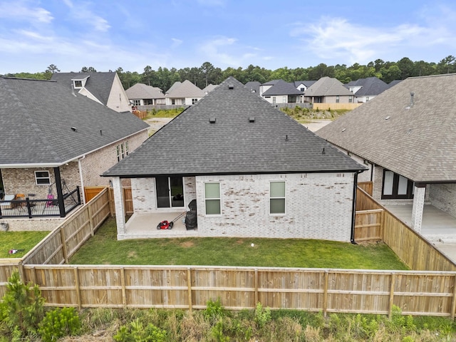 81 Fletcher Ridge Dr, Little Rock, AR 72223 - back of property featuring a patio, a shingled roof, brick siding, and a residential view