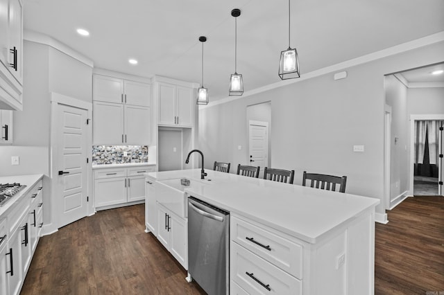 81 Fletcher Ridge Dr, Little Rock, AR 72223 - kitchen featuring stainless steel dishwasher, a sink, recessed lighting, dark wood-style floors, and a center island with sink