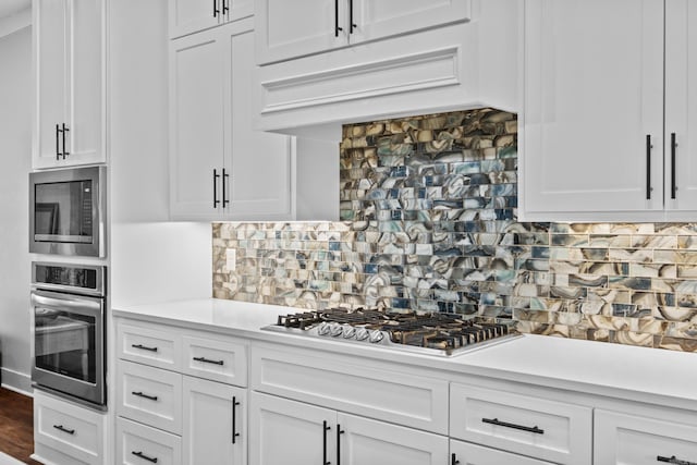 81 Fletcher Ridge Dr, Little Rock, AR 72223 - kitchen with stainless steel appliances, light countertops, and white cabinetry