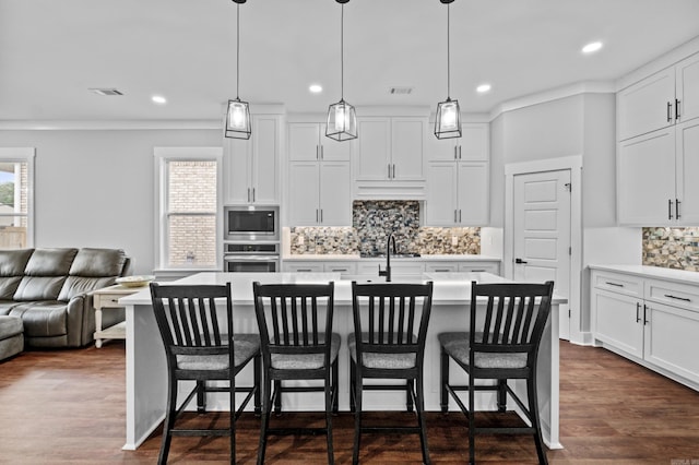 81 Fletcher Ridge Dr, Little Rock, AR 72223 - kitchen featuring appliances with stainless steel finishes, open floor plan, recessed lighting, backsplash, and light countertops