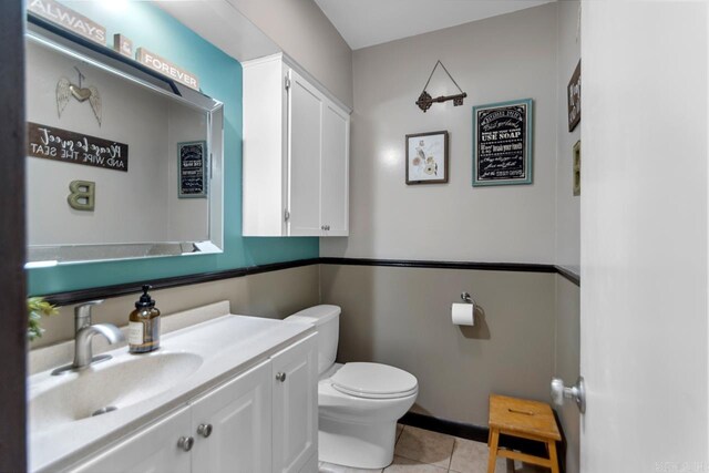 2006 Gunpowder Rd, Little Rock, AR 72227 - bathroom with toilet, vanity, and tile patterned floors