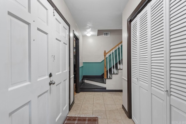 2006 Gunpowder Rd, Little Rock, AR 72227 - entryway featuring light tile patterned floors, stairs, and baseboards
