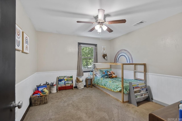 2006 Gunpowder Rd, Little Rock, AR 72227 - bedroom with a wainscoted wall, carpet floors, and a ceiling fan