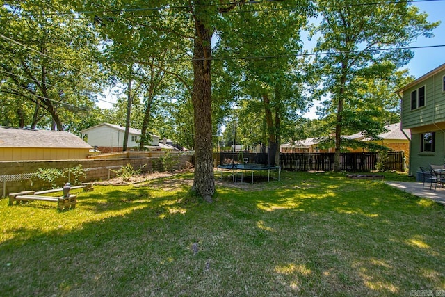2006 Gunpowder Rd, Little Rock, AR 72227 - view of yard featuring a trampoline and a patio area