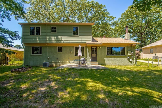 2006 Gunpowder Rd, Little Rock, AR 72227 - back of property featuring brick siding, a chimney, and a patio area