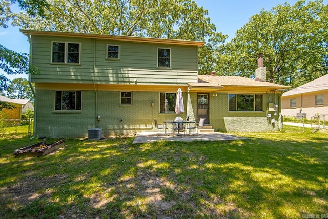2006 Gunpowder Rd, Little Rock, AR 72227 - back of house featuring a chimney, brick siding, and a patio area