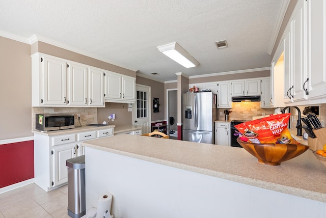 1 Forest Brook Ct, Little Rock, AR 72211 - kitchen with stainless steel appliances, light countertops, tasteful backsplash, a textured ceiling, and crown molding