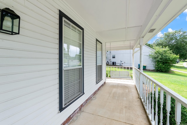 1 Forest Brook Ct, Little Rock, AR 72211 - covered porch featuring a lawn