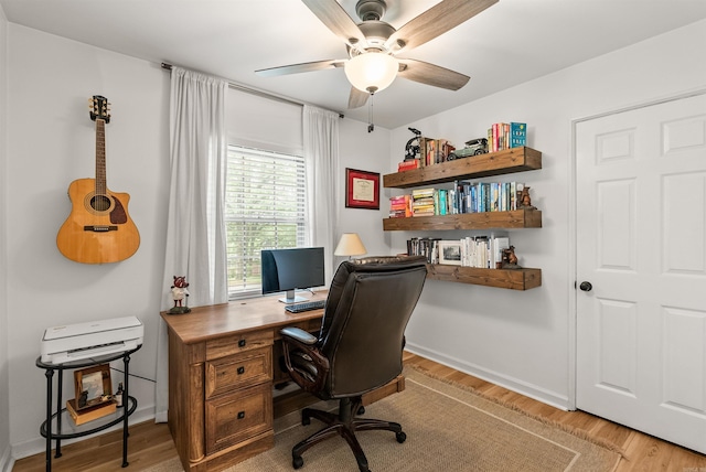 8010 Iowa Dr, Little Rock, AR 72227 - office area featuring light wood-style floors, a ceiling fan, and baseboards