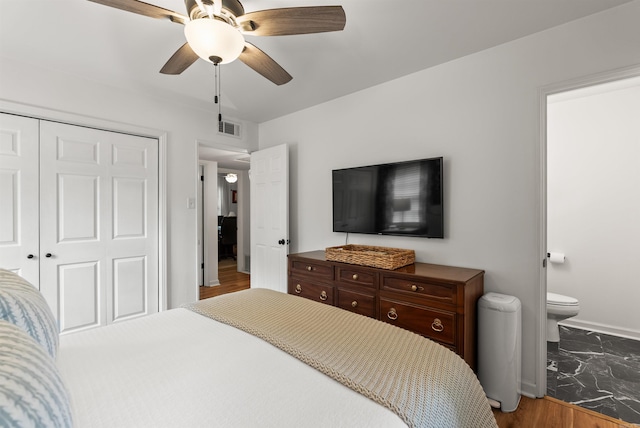 8010 Iowa Dr, Little Rock, AR 72227 - bedroom with a closet, baseboards, a ceiling fan, and connected bathroom