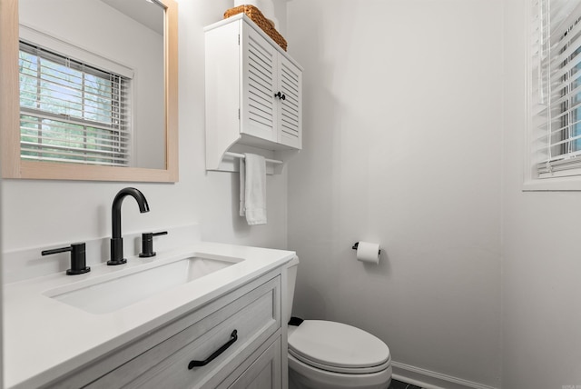 8010 Iowa Dr, Little Rock, AR 72227 - bathroom featuring vanity, toilet, and baseboards