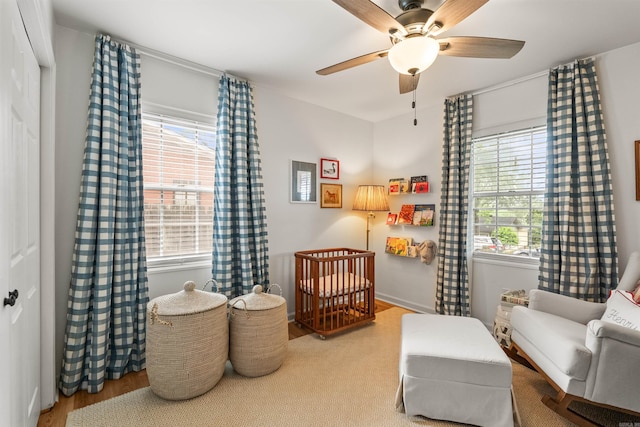 8010 Iowa Dr, Little Rock, AR 72227 - bedroom with multiple windows, a crib, and ceiling fan