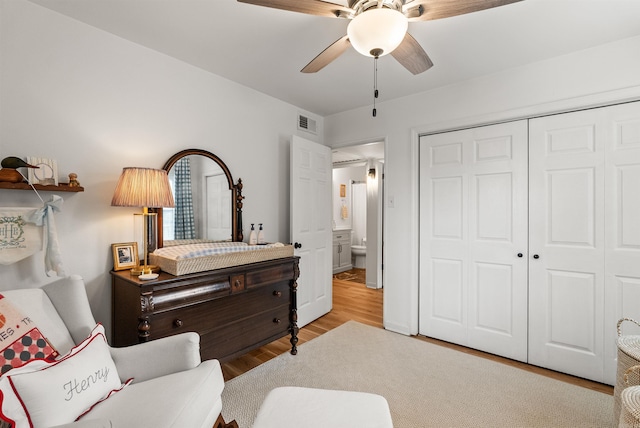 8010 Iowa Dr, Little Rock, AR 72227 - bedroom with wood finished floors, a closet, and a ceiling fan