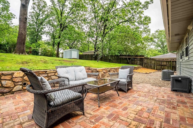 8010 Iowa Dr, Little Rock, AR 72227 - view of patio featuring an outdoor hangout area and central AC unit