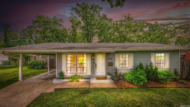 8010 Iowa Dr, Little Rock, AR 72227 - ranch-style home with concrete driveway, an attached carport, and a porch