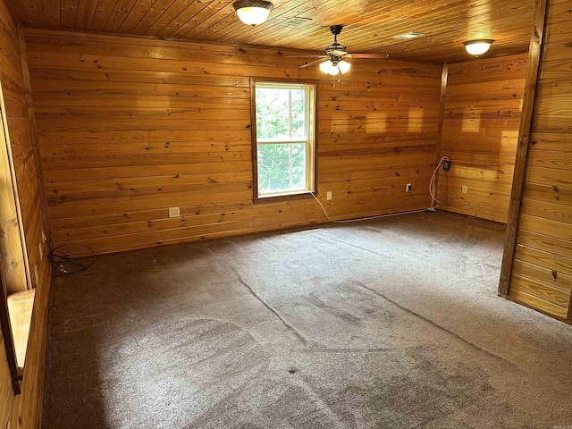 540 Polk Rd 78, Mena, AR 71953 - carpeted spare room featuring wood ceiling, ceiling fan, and wooden walls
