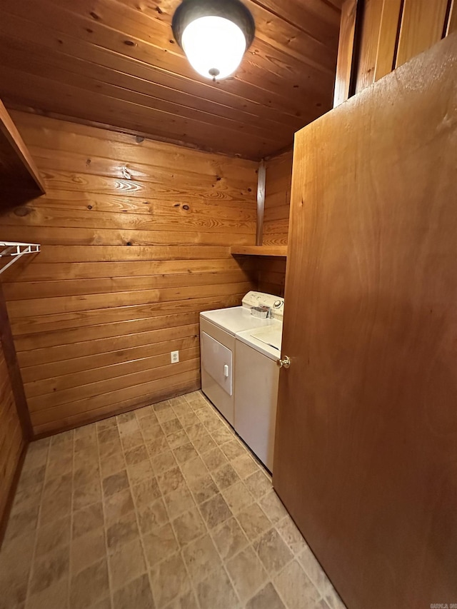 540 Polk Rd 78, Mena, AR 71953 - washroom featuring separate washer and dryer, wooden walls, and wooden ceiling