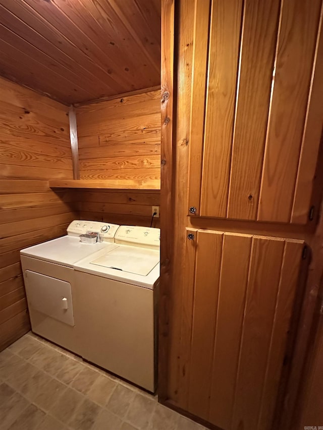 540 Polk Rd 78, Mena, AR 71953 - laundry area with wood walls, independent washer and dryer, cabinet space, and wood ceiling