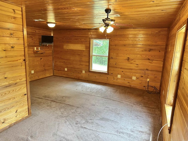 540 Polk Rd 78, Mena, AR 71953 - spare room with a ceiling fan, carpet, wooden ceiling, and wood walls
