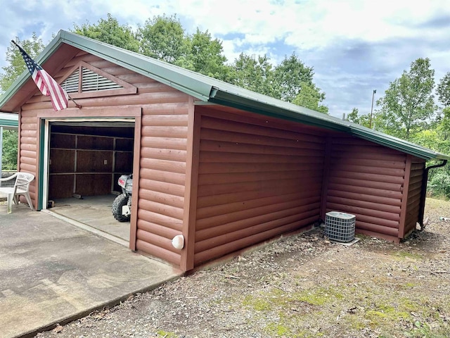 540 Polk Rd 78, Mena, AR 71953 - detached garage featuring concrete driveway and central AC unit
