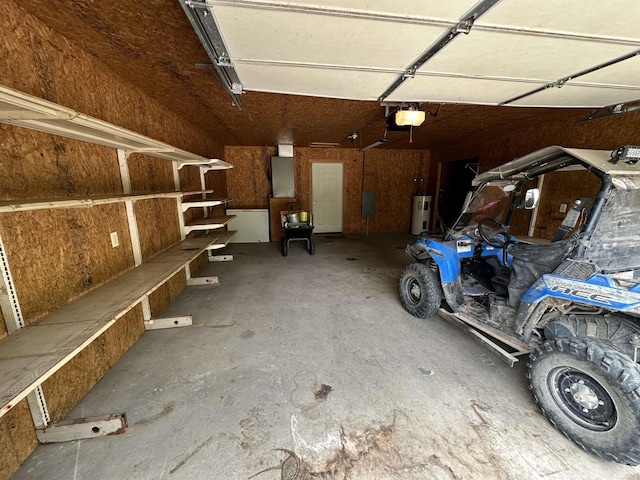540 Polk Rd 78, Mena, AR 71953 - garage with a garage door opener and electric water heater