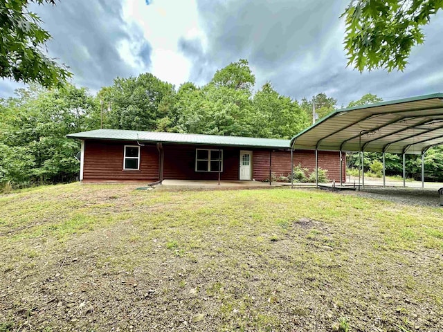 540 Polk Rd 78, Mena, AR 71953 - view of front of house featuring a carport and a front lawn