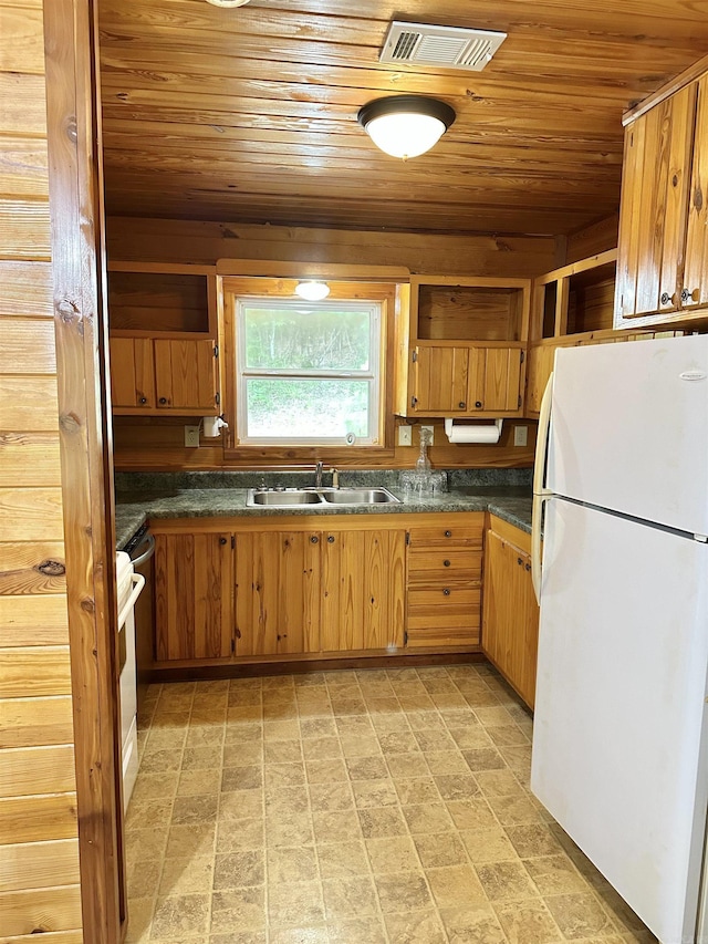 540 Polk Rd 78, Mena, AR 71953 - kitchen with freestanding refrigerator, a sink, wood ceiling, open shelves, and dark countertops