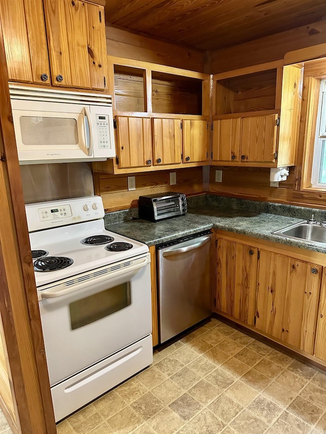 540 Polk Rd 78, Mena, AR 71953 - kitchen featuring white appliances, wood ceiling, a sink, dark countertops, and brown cabinetry