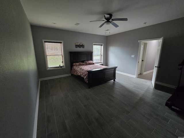 23 Whispering Dr, Alexander, AR 72002 - bedroom with dark wood-style flooring, baseboards, and a ceiling fan