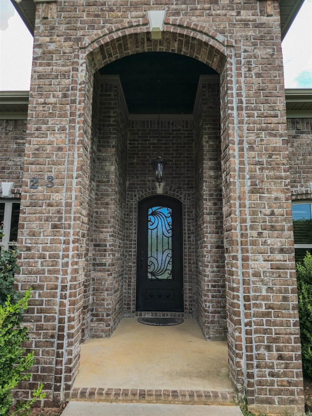 23 Whispering Dr, Alexander, AR 72002 - view of exterior entry with brick siding
