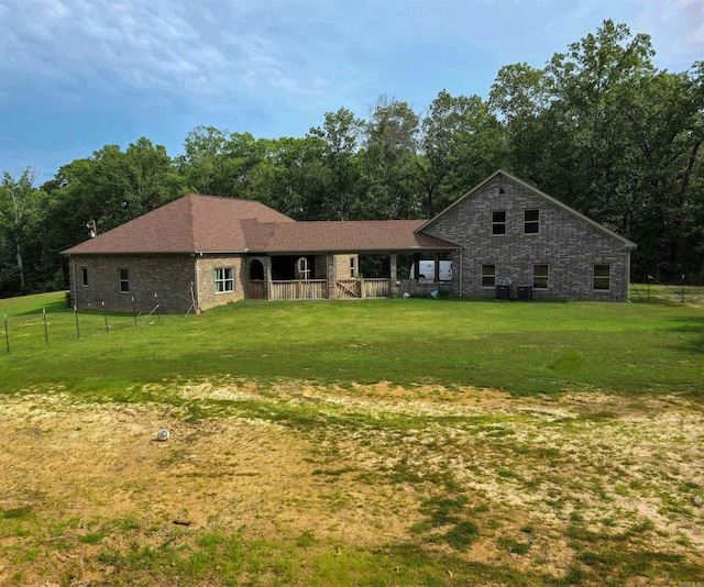 23 Whispering Dr, Alexander, AR 72002 - view of front of house featuring a porch, brick siding, and view of scattered trees