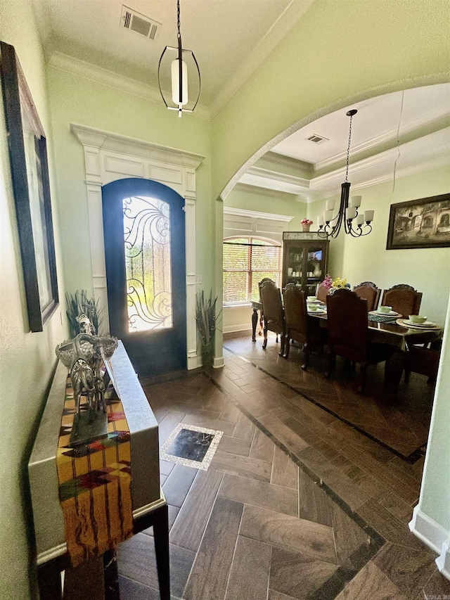 23 Whispering Dr, Alexander, AR 72002 - foyer with arched walkways, crown molding, a chandelier, baseboards, and a raised ceiling