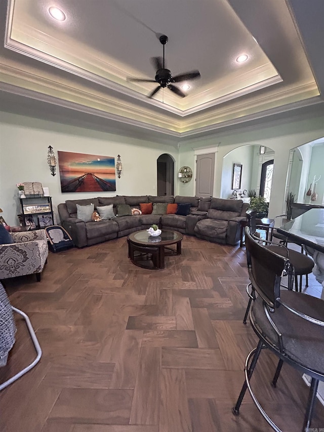 23 Whispering Dr, Alexander, AR 72002 - living area featuring a tray ceiling, crown molding, ceiling fan, arched walkways, and recessed lighting