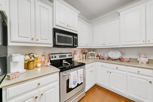 43 Earnhardt Cir, Cabot, AR 72023 - kitchen featuring stainless steel appliances, white cabinetry, light countertops, and light wood-type flooring