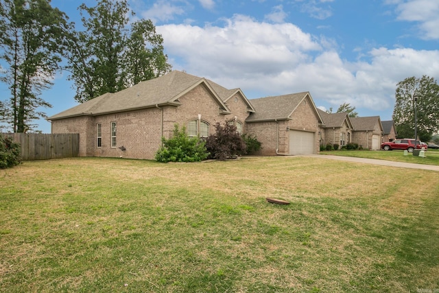 43 Earnhardt Cir, Cabot, AR 72023 - view of front facade featuring brick siding, driveway, a garage, and roof with shingles