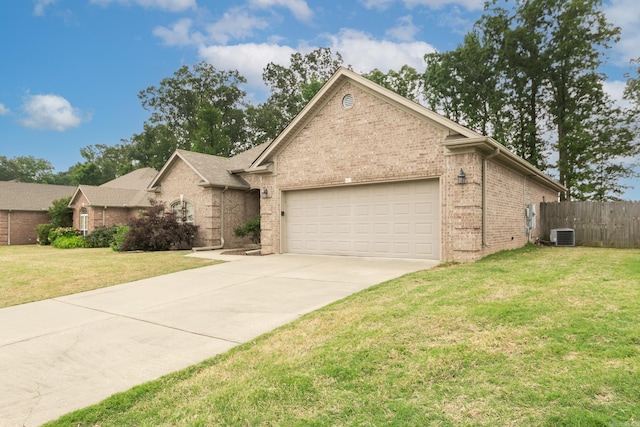 43 Earnhardt Cir, Cabot, AR 72023 - view of front of house with an attached garage, brick siding, concrete driveway, and central AC unit