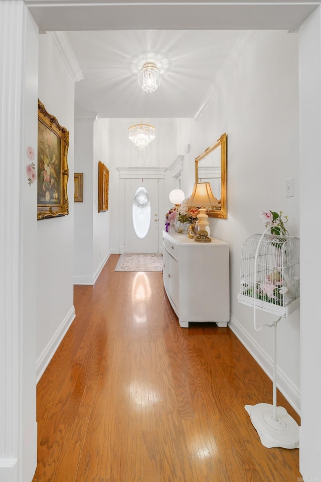 43 Earnhardt Cir, Cabot, AR 72023 - foyer entrance with a chandelier, wood finished floors, ornamental molding, and baseboards
