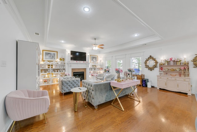 43 Earnhardt Cir, Cabot, AR 72023 - living room featuring ceiling fan, a tray ceiling, light wood-type flooring, crown molding, and recessed lighting
