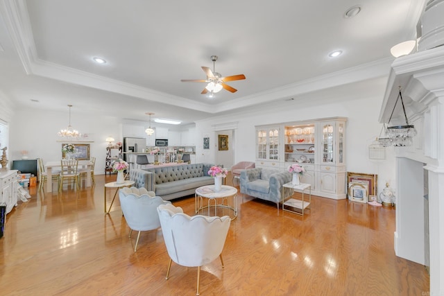 43 Earnhardt Cir, Cabot, AR 72023 - living area with a tray ceiling, a ceiling fan, light wood finished floors, recessed lighting, and ornamental molding