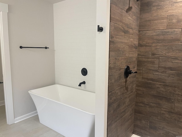 10683 W Miller Sardis, Bauxite, AR 72011 - bathroom with a freestanding bath, a tile shower, and baseboards