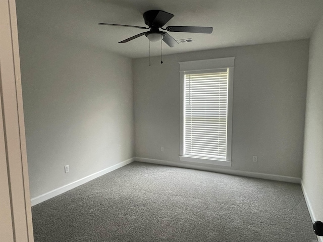 10683 W Miller Sardis, Bauxite, AR 72011 - spare room featuring carpet flooring, baseboards, and a ceiling fan